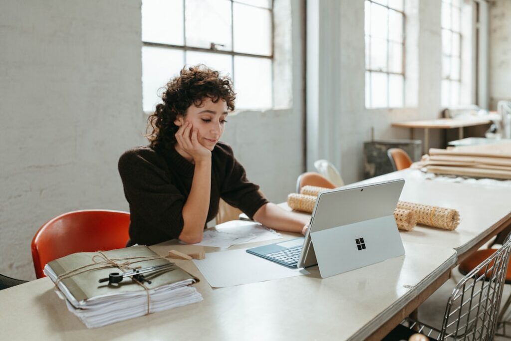 Small business owner looking stressed while reading a specific clause in a contract