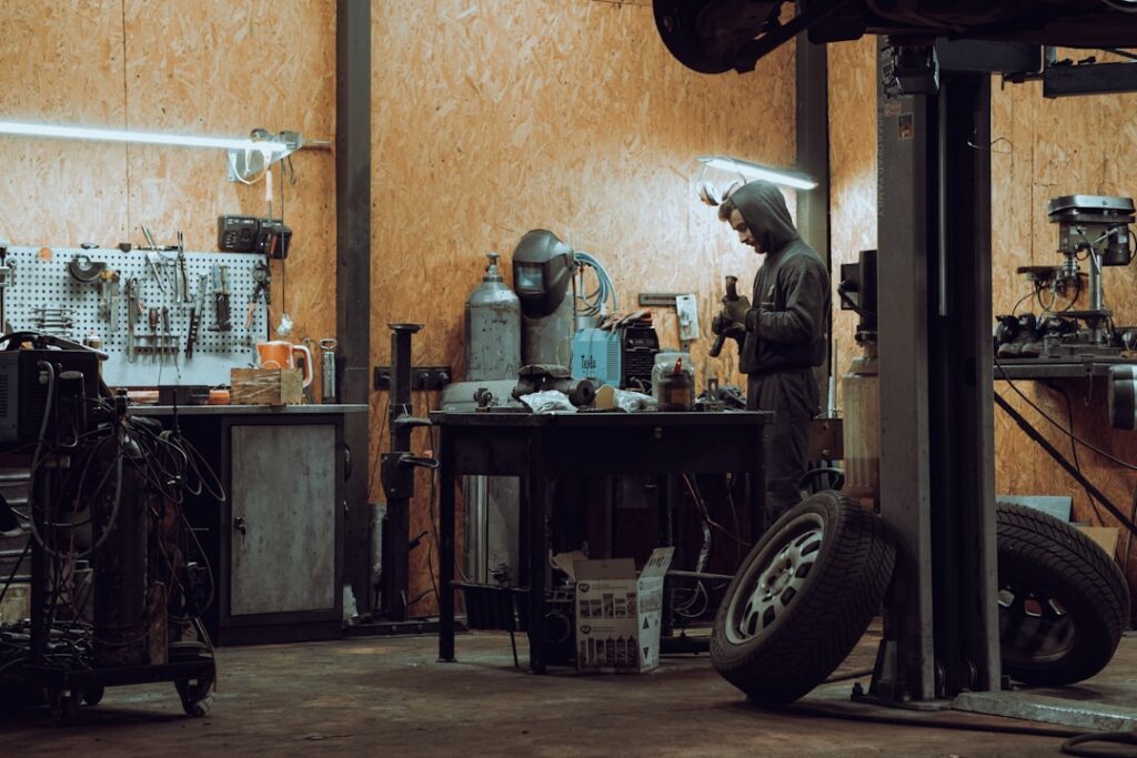 Semi truck undergoing repair at a maintenance shop