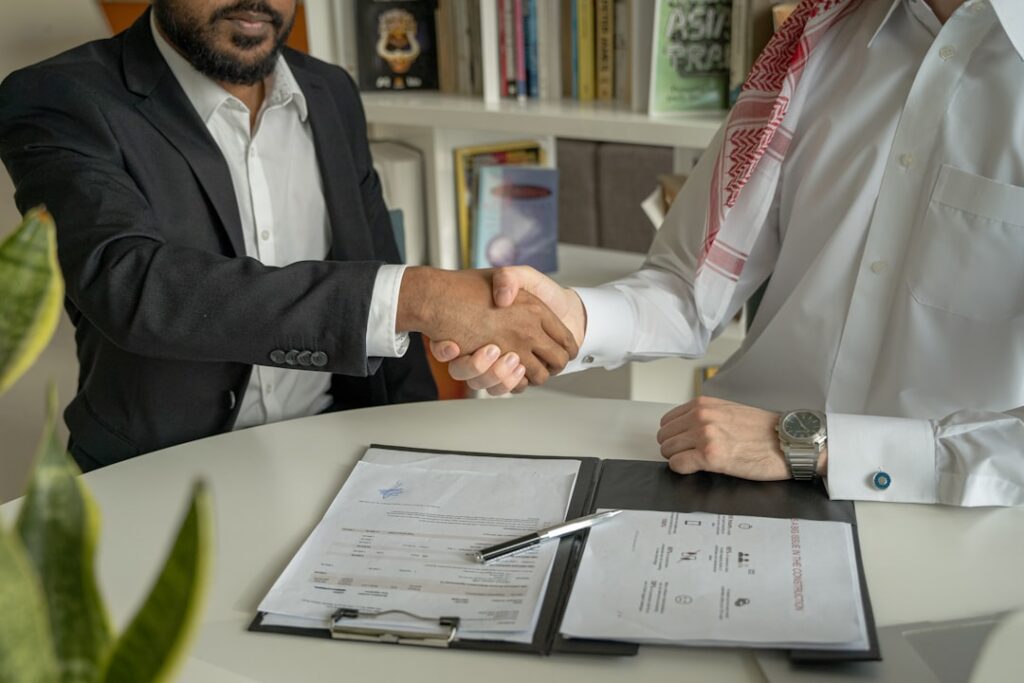 Handshake between a contractor and subcontractor after resolving a payment dispute