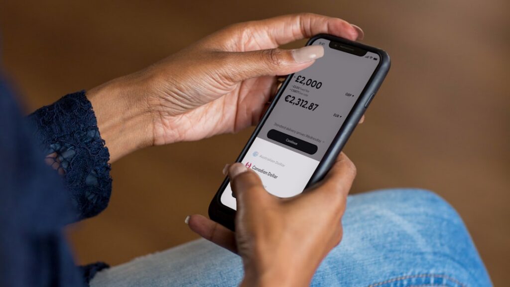 Smartphone showing a daily bank debit notification