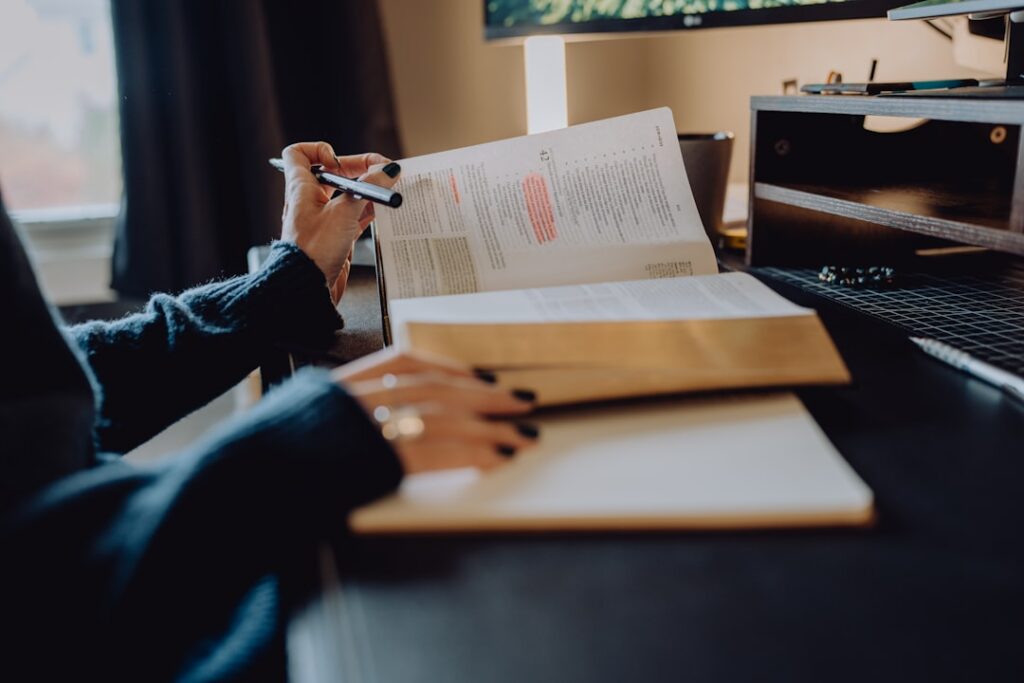 Small business owner organizing contract paperwork and a payment calendar