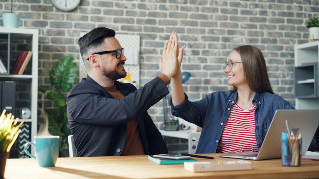Handshake across a desk after a negotiated business agreement
