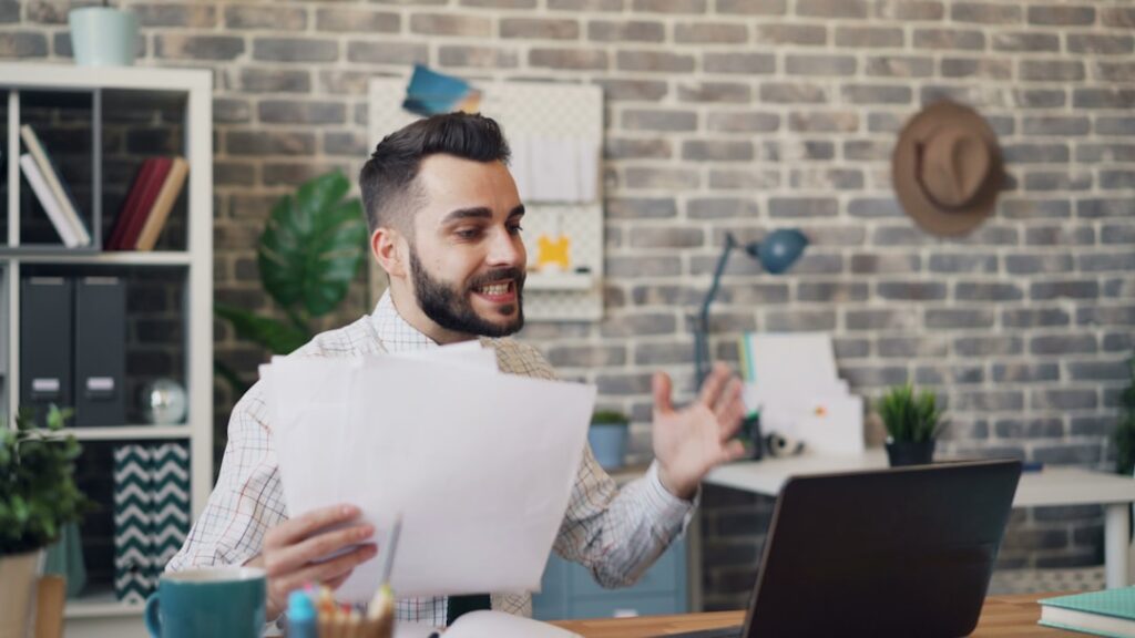 Business owner reviewing MCA contract fine print at a desk