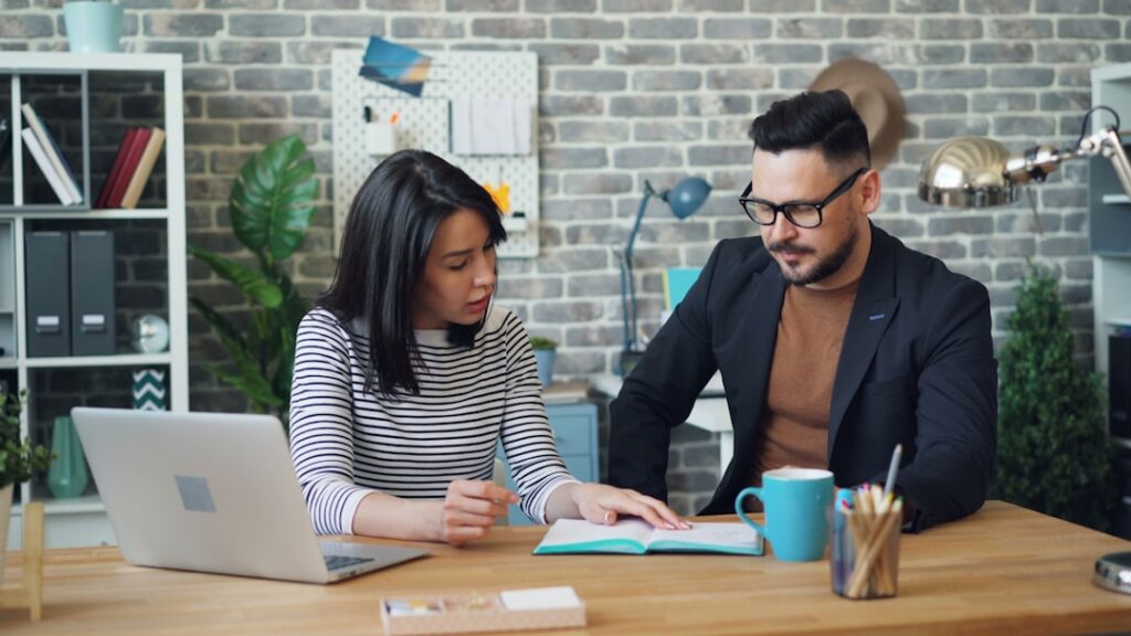 Business owner negotiating settlement terms across a desk