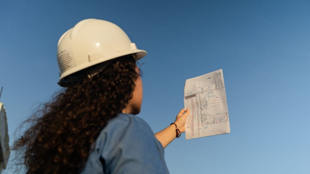 Contractor reviewing surety bond and financing paperwork with an advisor