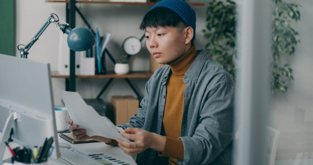 Business owner reading the fine print on a commercial financing disclosure form