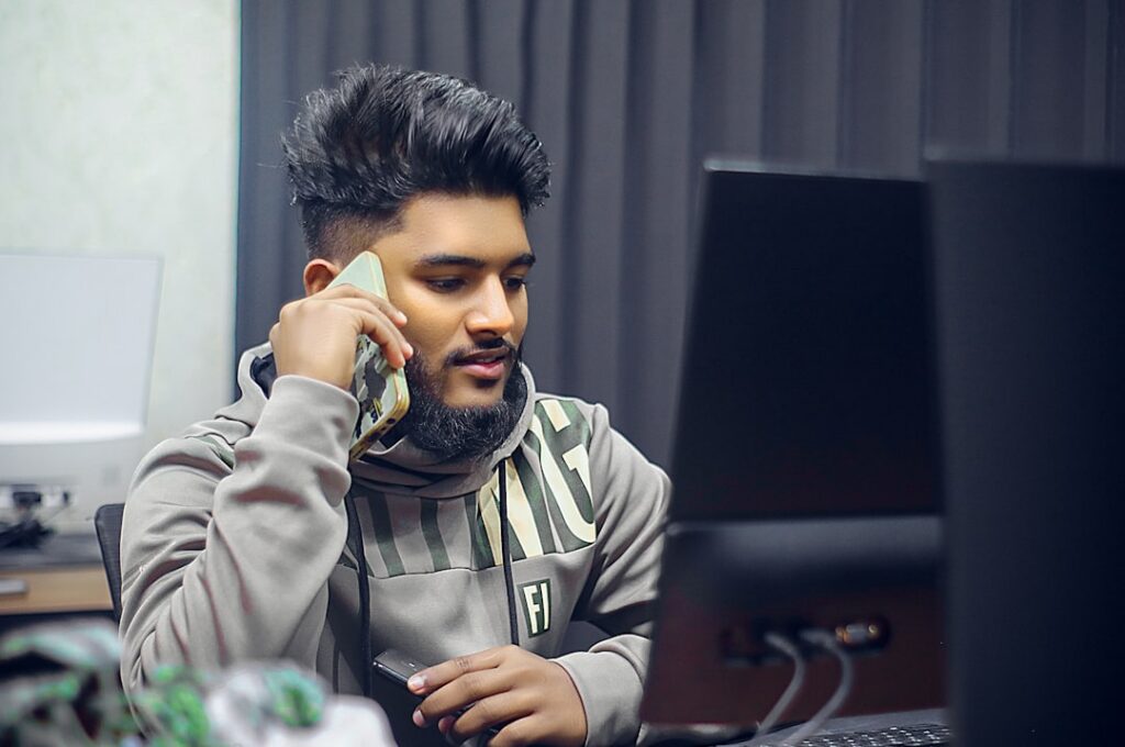Small business owner on the phone reviewing paperwork with a concerned expression