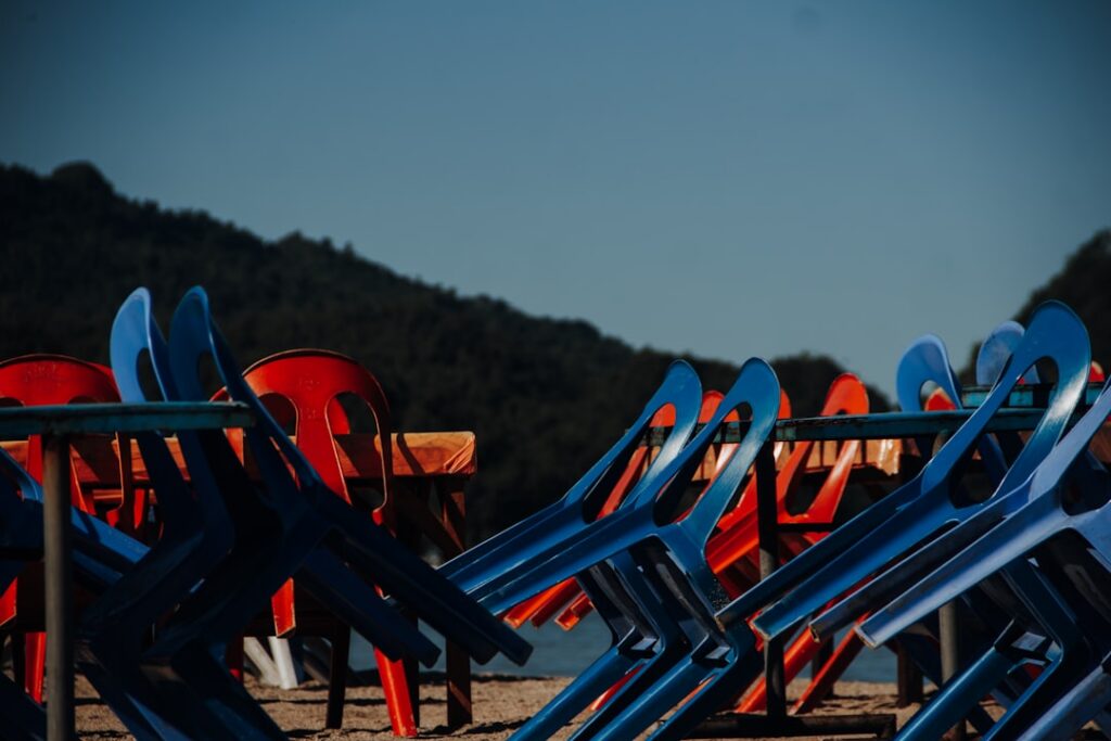 Empty bar patio with chairs stacked during the off season