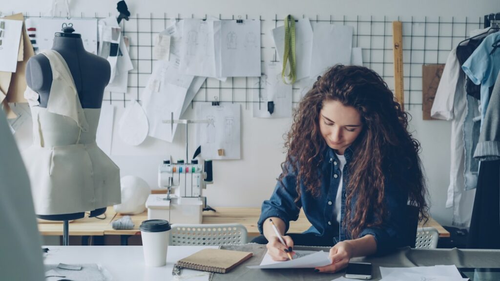 Independent retail owner reviewing back-to-school inventory orders and invoices