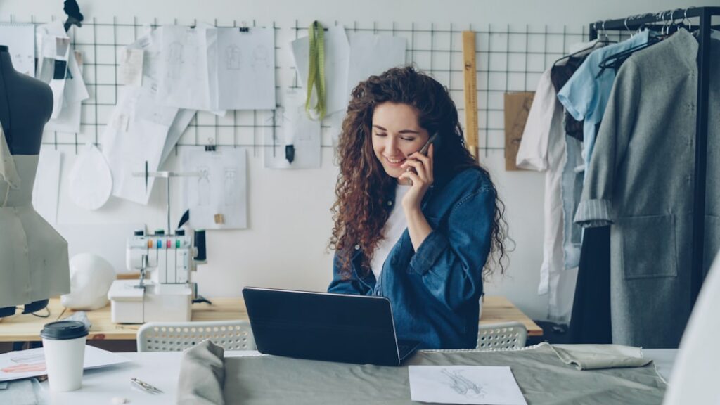 Business owner examining a debt relief contract on a laptop, looking skeptical