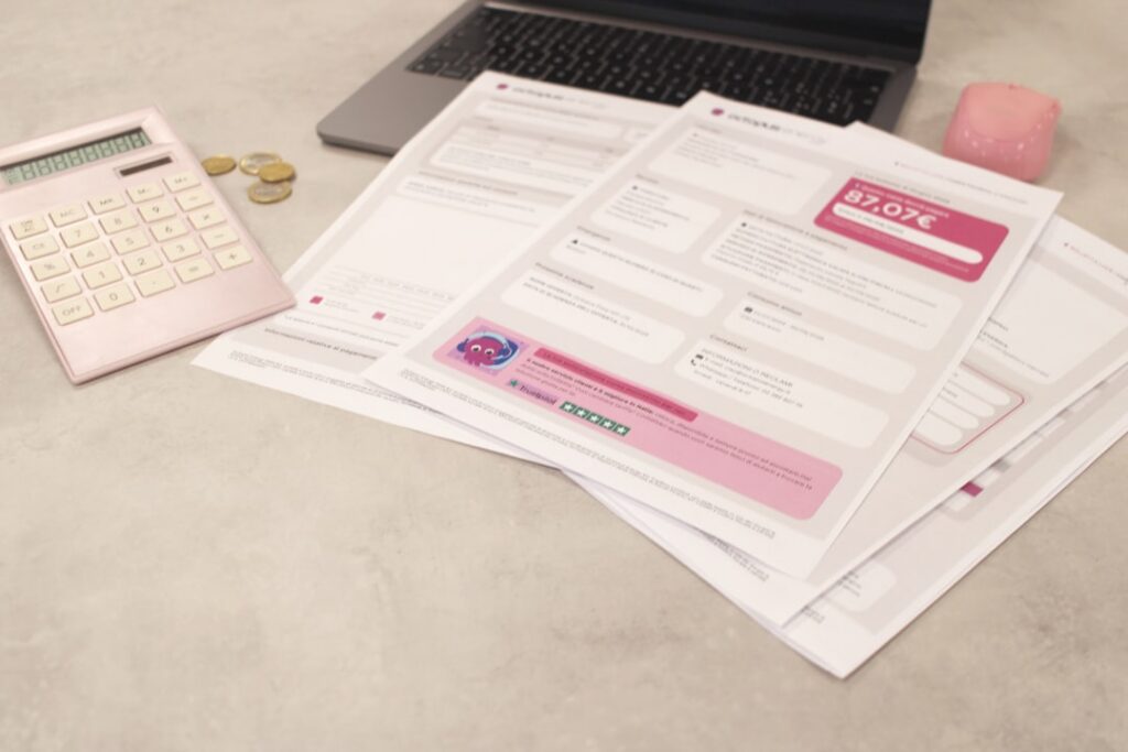 Stack of overdue notices and bank statements on a desk
