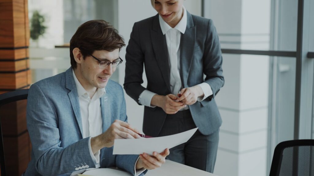 Small business owner shaking hands with an advisor after reaching an agreement