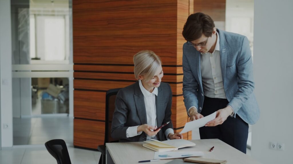 Financial professionals reviewing investment risk documents