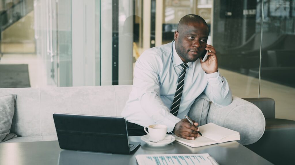 Confident small business owner on a phone call negotiating in office