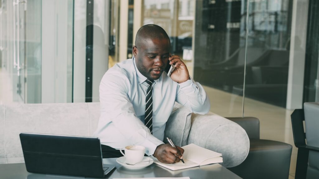 Staffing agency owner reviewing and signing MCA debt settlement agreement documents