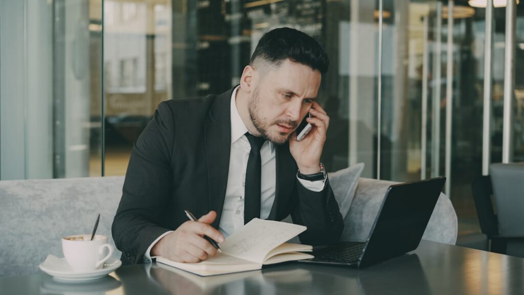 Business owner on the phone looking frustrated during a high-pressure sales call