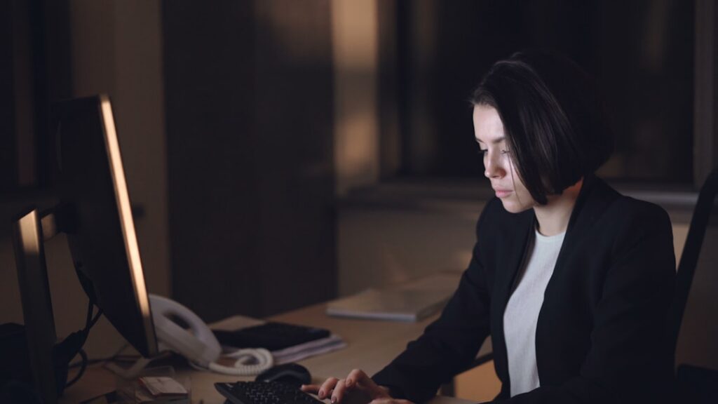 Frustrated e-commerce business owner reviewing falling cash flow on laptop