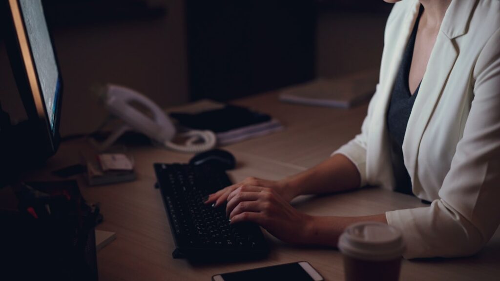 Staffing agency owner reviewing cash flow statements and bank account under financial pressure