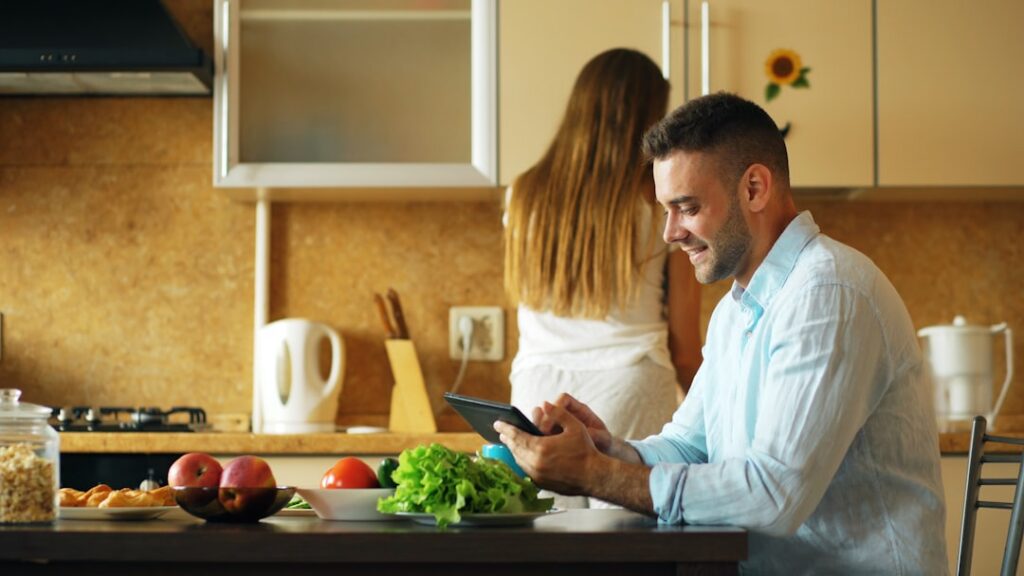 Delivery fleet owner reviewing paperwork and bills at home