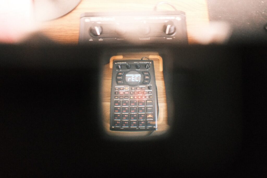 Calculator and bank statement on a desk with medical spa laser equipment nearby