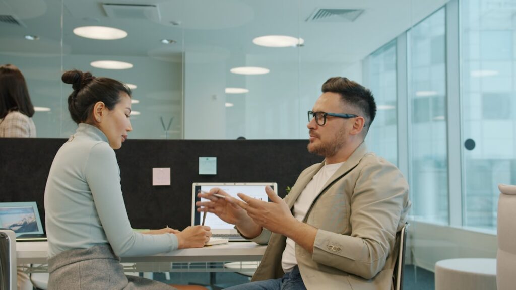 Small business owner discussing loan refinancing options with a bank officer