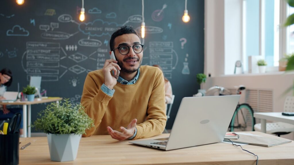 Small business owner calling MCA relief specialist for help