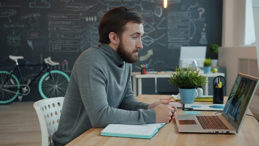 Business owner on a conference call negotiating terms with financing partners
