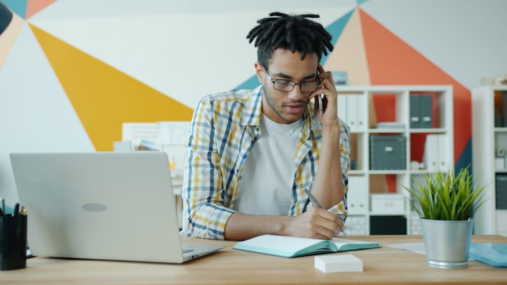Small business owner reviewing financial documents with a confident, resolved expression