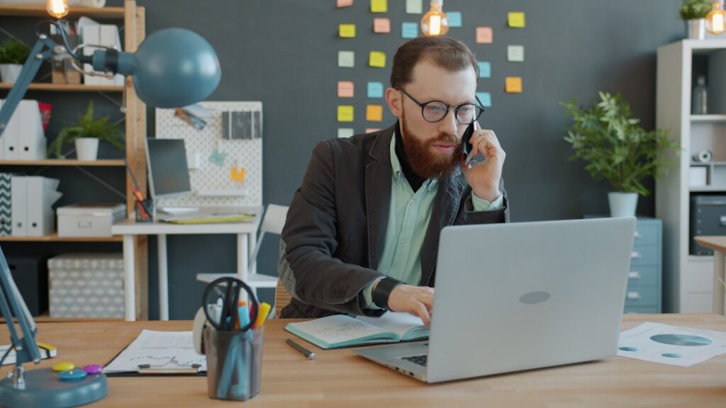 Business owner on the phone negotiating a settlement with an MCA funder