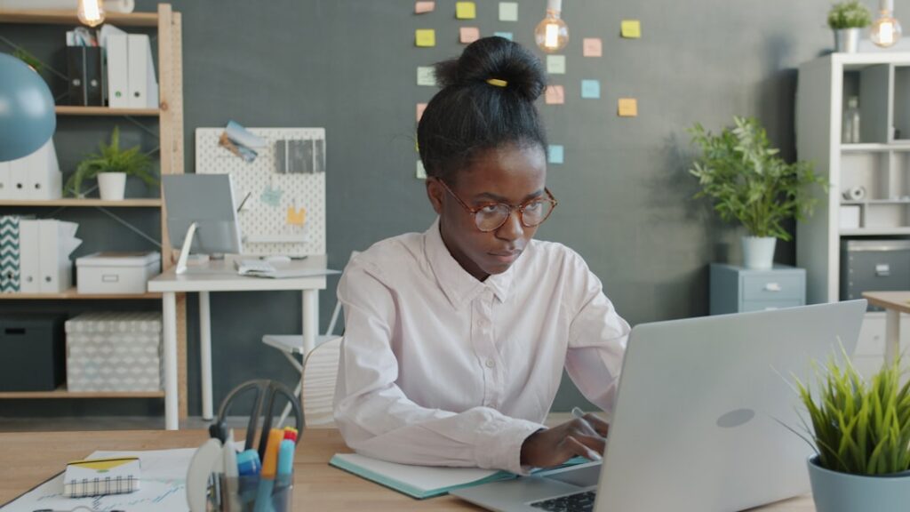 Pharmacist reviewing insurance claim reimbursement data on a computer