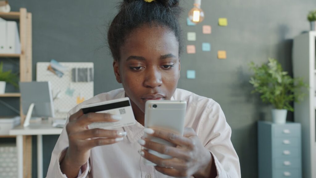 Small business owner reading a payment terminal notification with a concerned expression