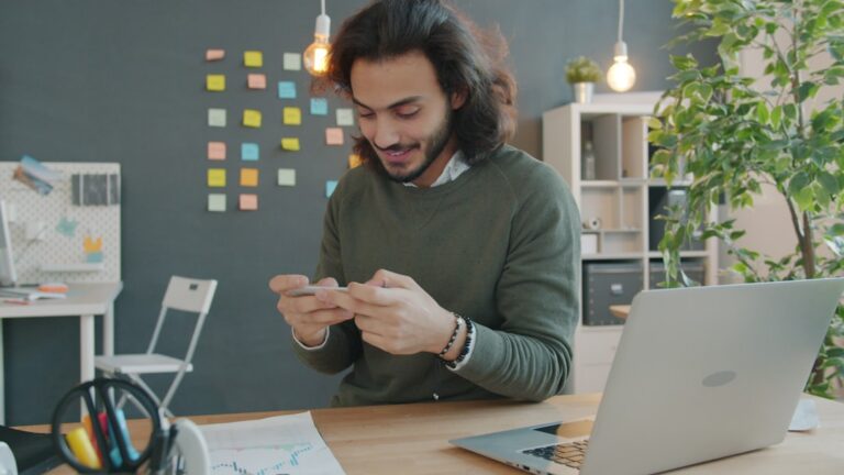 Small business owner reviewing financial documents and bank statements under pressure