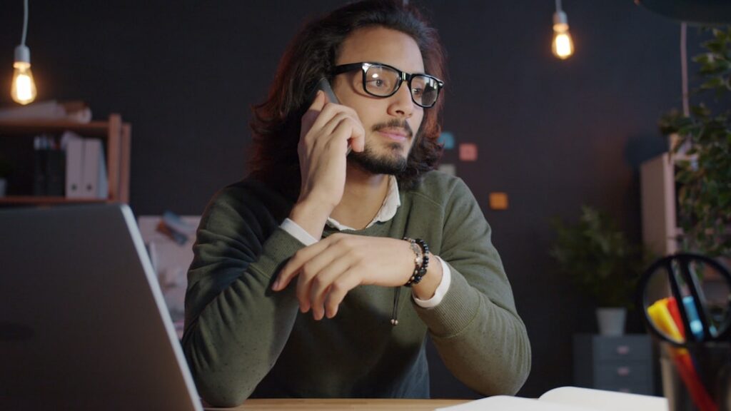 Worried small business owner on a phone call discussing their bank account