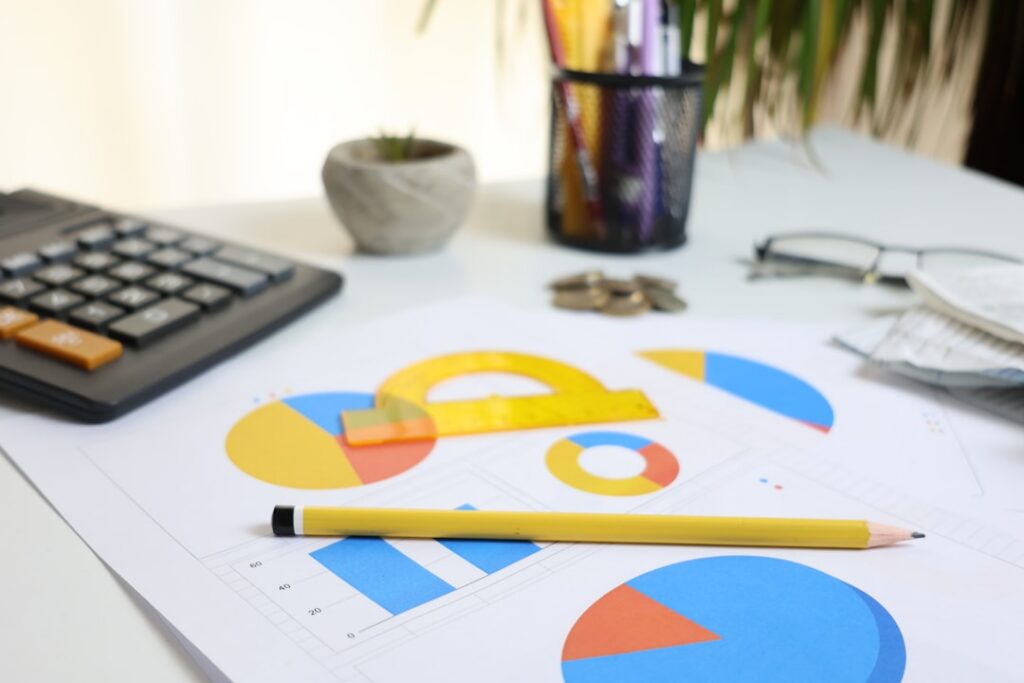 Magnifying glass over a bank statement highlighting transactions