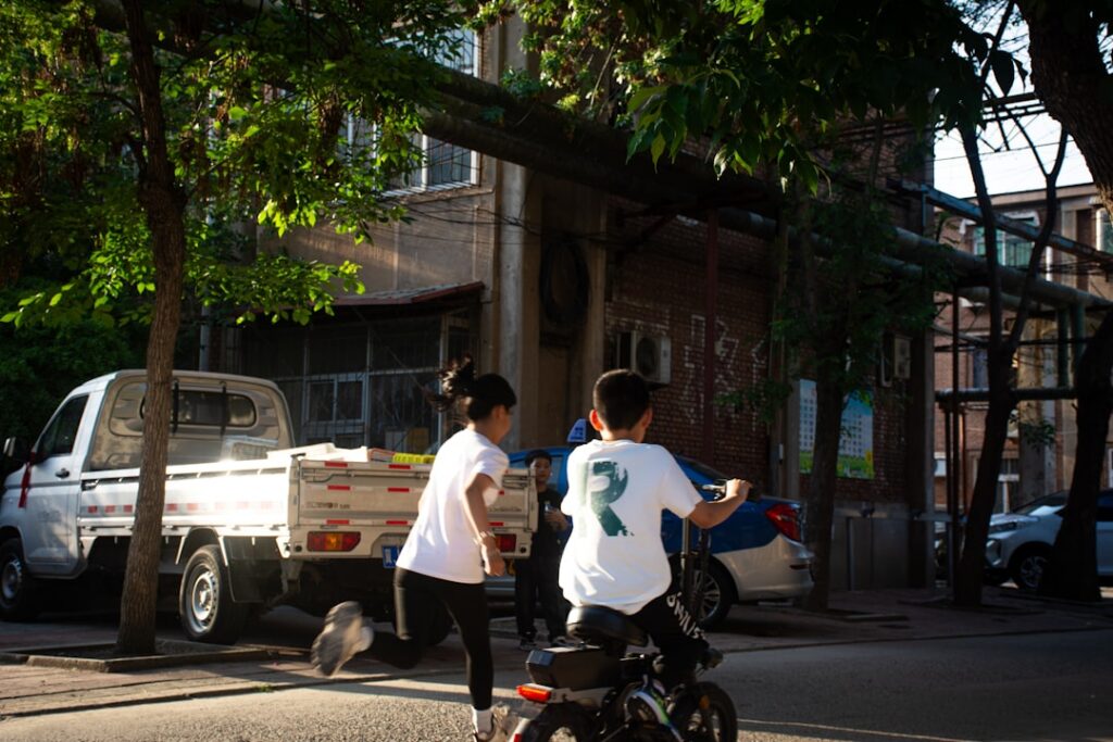 Moving crew carrying boxes into a truck during a busy summer relocation