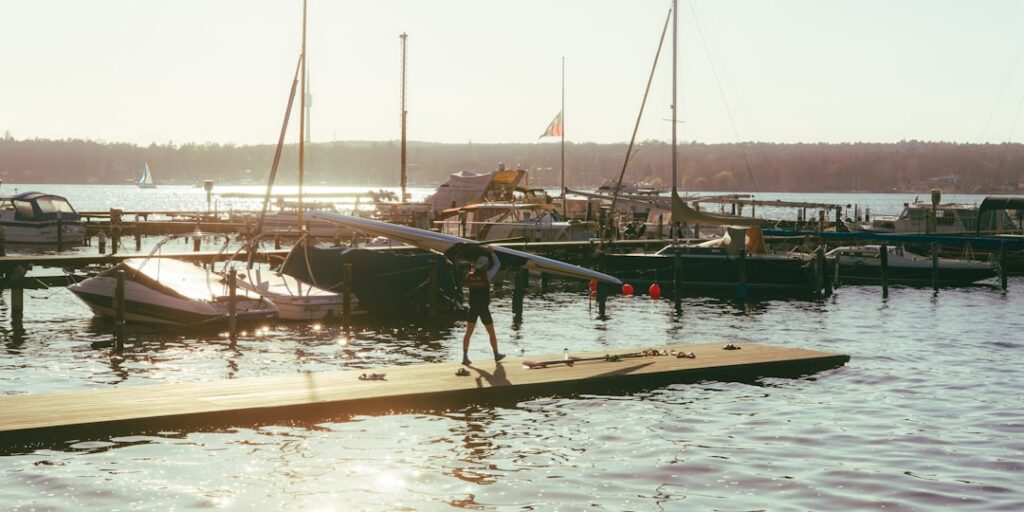 Rows of boats docked at a busy marina during peak summer season