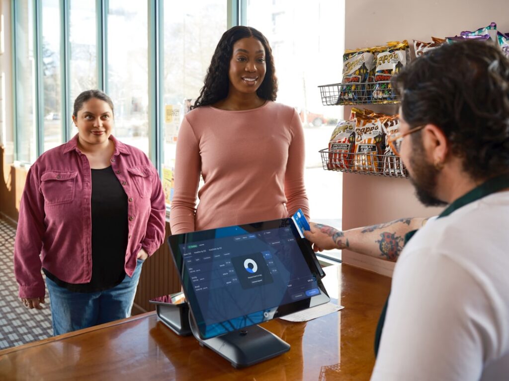 Credit card payment terminal in use at a small retail store counter