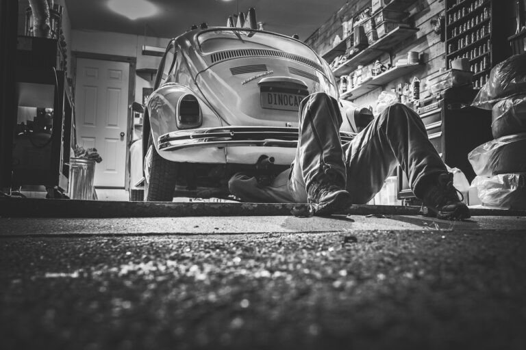 Auto repair shop owner reviewing paperwork at the service counter