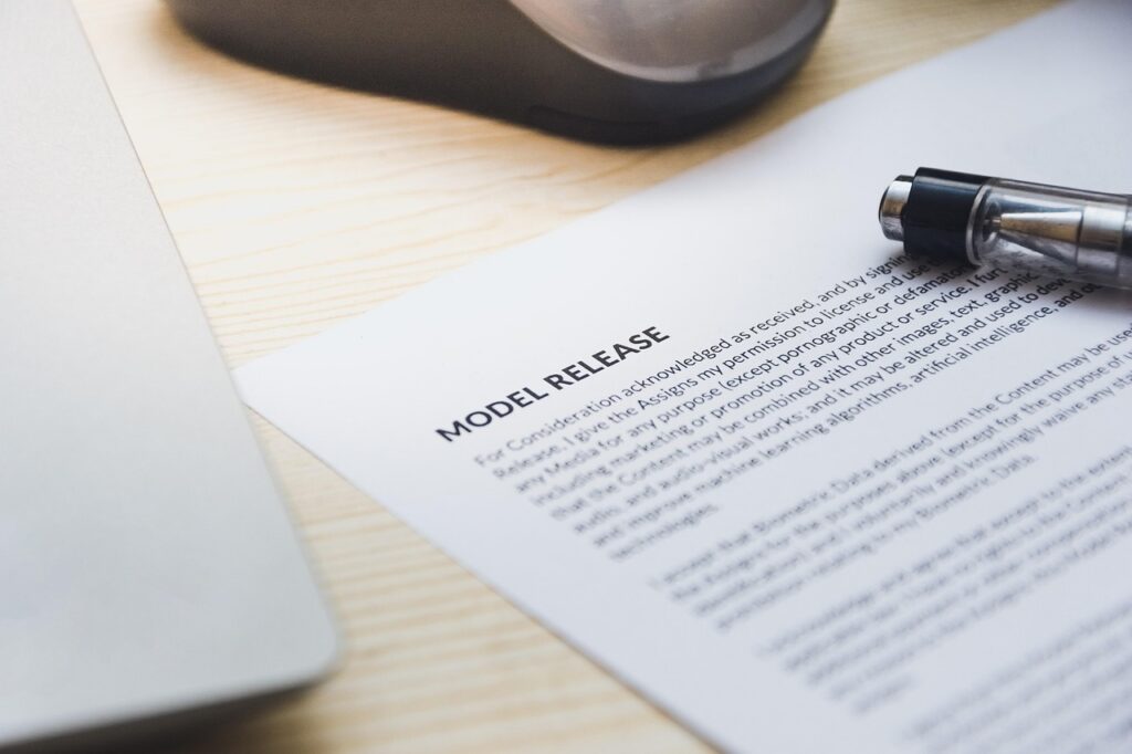 Small business owner signing a financing contract at a small office desk