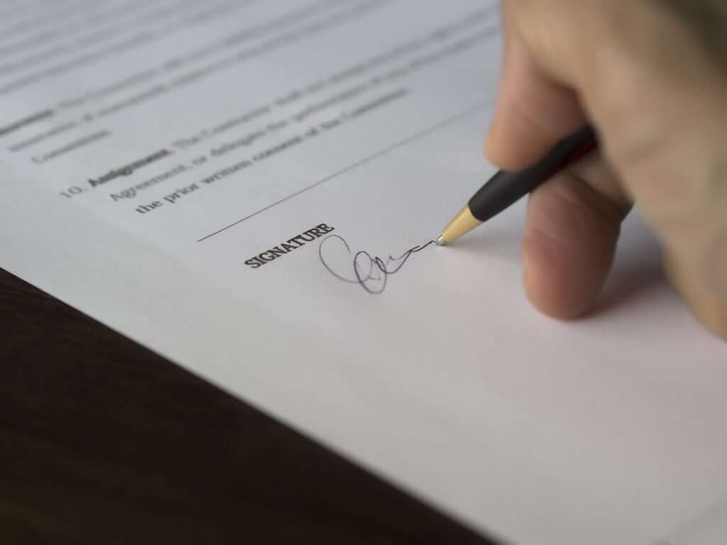 Business owner reviewing legal paperwork with concern at a table