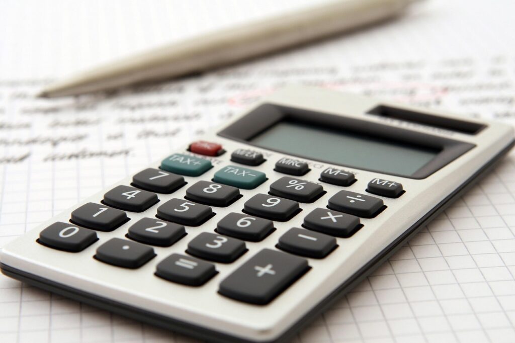 Dental equipment and a calculator representing the cost of practice financing