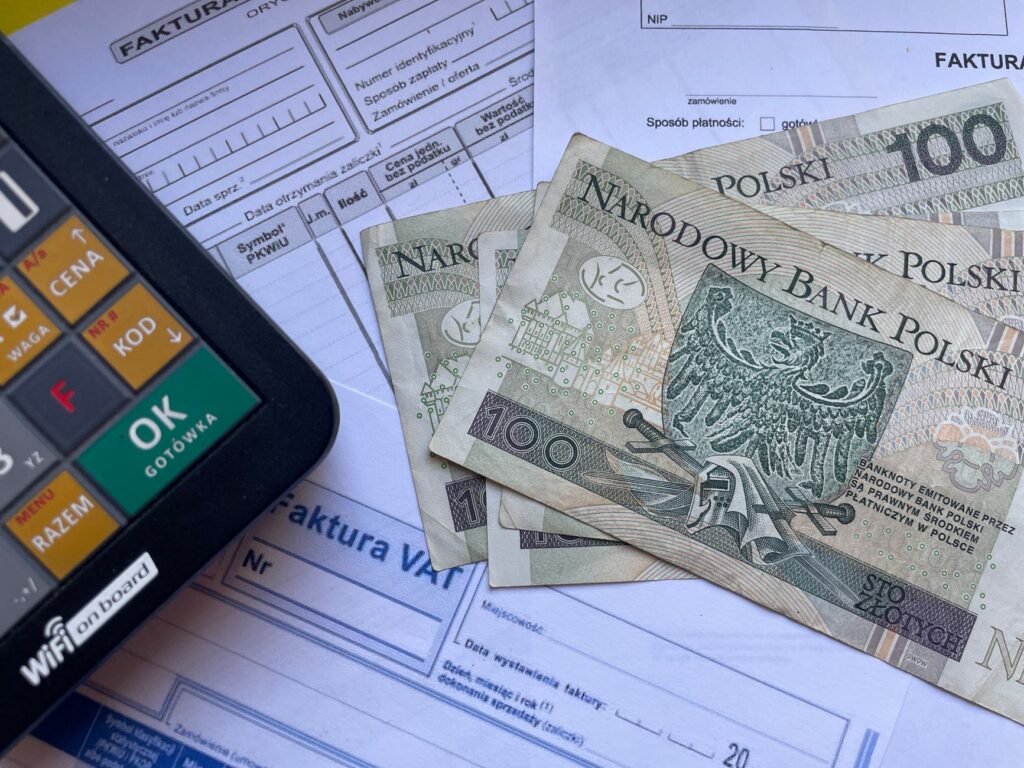 Stacked invoices and a calculator representing multiple advance payments