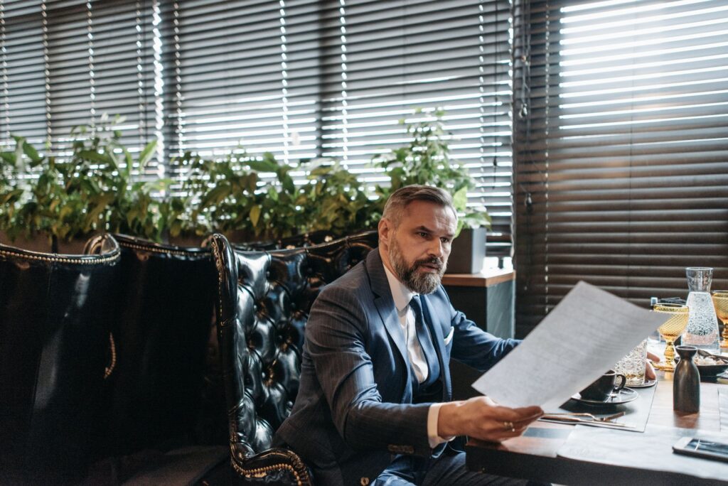 Multi-location business owner reviewing financing paperwork