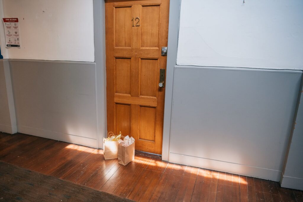 Hallway inside a county courthouse with tall wooden doors