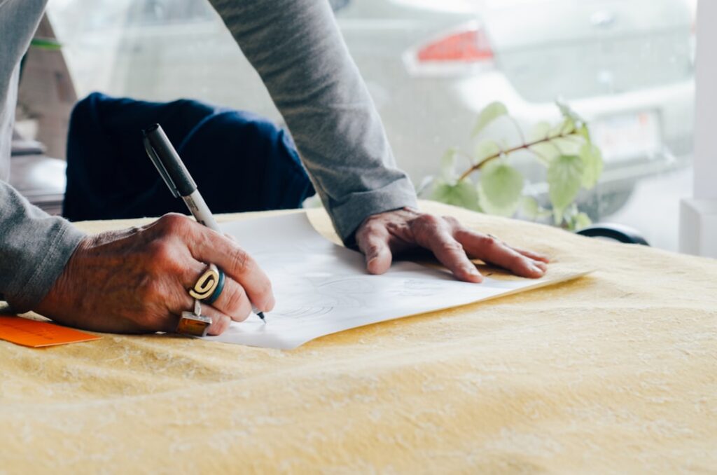 Close-up of a business owner signing a personal guaranty contract