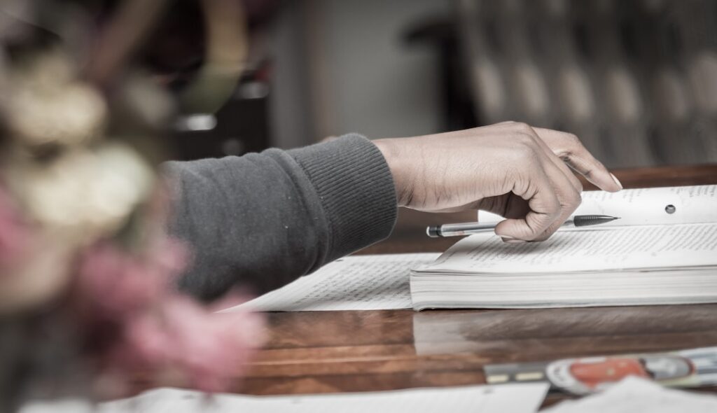 Close-up of a business owner signing a financing contract