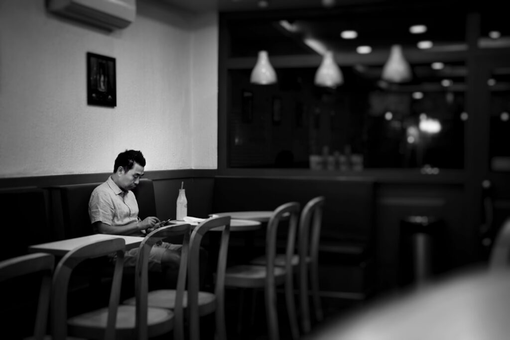 Business owner overwhelmed by multiple stacked merchant cash advance statements
