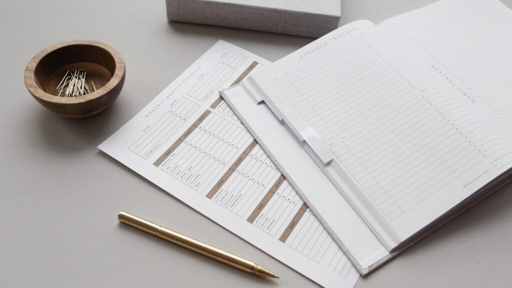 Stack of merchant cash advance contracts on an office desk