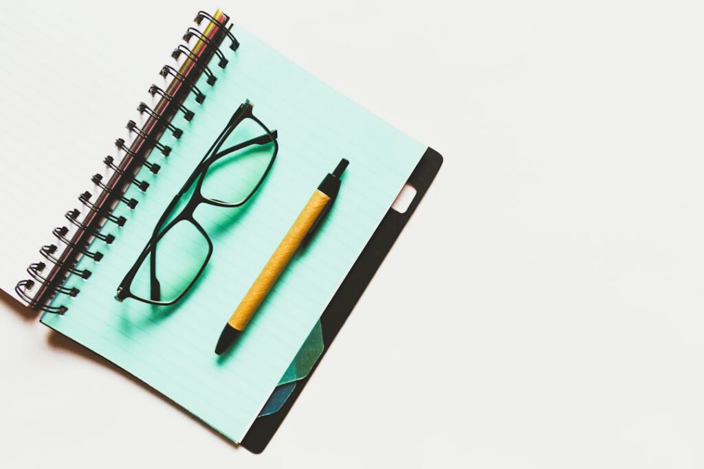 Personal guaranty document with pen and reading glasses