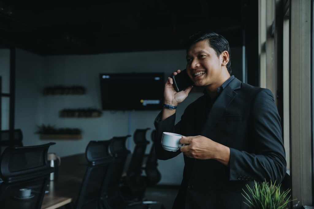 Business owner confidently talking on the phone with an advisor